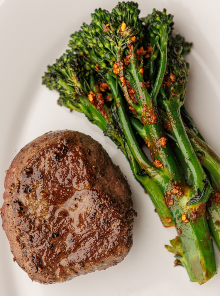 steak and brocoli served on a plate